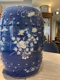 A pair of Chinese white slip-decorated blue-ground garden seats, 19th C.