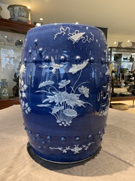 A pair of Chinese white slip-decorated blue-ground garden seats, 19th C.
