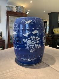 A pair of Chinese white slip-decorated blue-ground garden seats, 19th C.