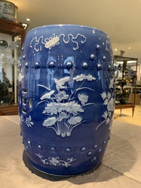 A pair of Chinese white slip-decorated blue-ground garden seats, 19th C.