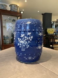A pair of Chinese white slip-decorated blue-ground garden seats, 19th C.