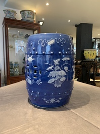 A pair of Chinese white slip-decorated blue-ground garden seats, 19th C.