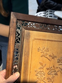 A large Chinese carved wooden table screen with a fine famille rose 'landscape' plaque, 19th C.