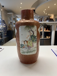 A Chinese famille rose coral-red-ground vase and a famille verte vase, 19th C.