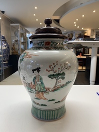 A Chinese famille rose coral-red-ground vase and a famille verte vase, 19th C.