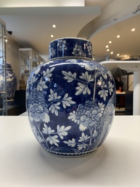 Two Chinese blue and white 'peonies' and 'peonies and antiquities' jars and covers, 19th C.