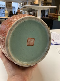 A Chinese famille rose coral-red-ground vase and a famille verte vase, 19th C.