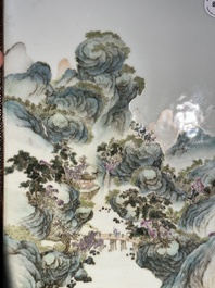 A large Chinese carved wooden table screen with a fine famille rose 'landscape' plaque, 19th C.