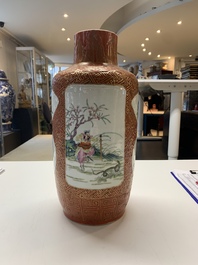 A Chinese famille rose coral-red-ground vase and a famille verte vase, 19th C.