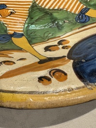 An Italian maiolica dish with a swordsman, Montelupo, early 17th C.
