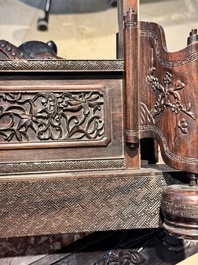 A large Chinese carved wooden table screen with a fine famille rose 'landscape' plaque, 19th C.