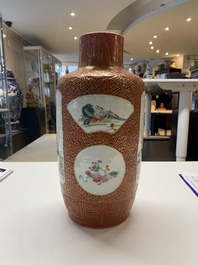 A Chinese famille rose coral-red-ground vase and a famille verte vase, 19th C.