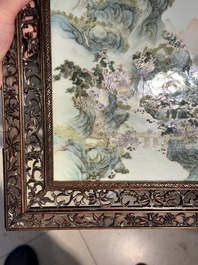 A large Chinese carved wooden table screen with a fine famille rose 'landscape' plaque, 19th C.