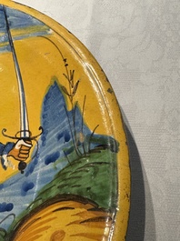 An Italian maiolica dish with a swordsman, Montelupo, early 17th C.