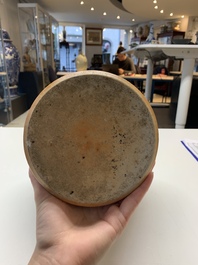 A Chinese famille rose coral-red-ground vase and a famille verte vase, 19th C.