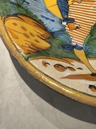 An Italian maiolica dish with a swordsman, Montelupo, early 17th C.