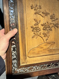 A large Chinese carved wooden table screen with a fine famille rose 'landscape' plaque, 19th C.