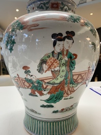 A Chinese famille rose coral-red-ground vase and a famille verte vase, 19th C.