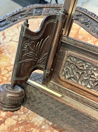 A large Chinese carved wooden table screen with a fine famille rose 'landscape' plaque, 19th C.