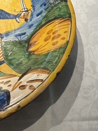 An Italian maiolica dish with a swordsman, Montelupo, early 17th C.
