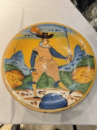 An Italian maiolica dish with a swordsman, Montelupo, early 17th C.