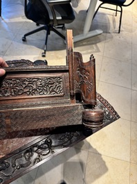 A large Chinese carved wooden table screen with a fine famille rose 'landscape' plaque, 19th C.