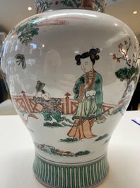 A Chinese famille rose coral-red-ground vase and a famille verte vase, 19th C.