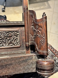A large Chinese carved wooden table screen with a fine famille rose 'landscape' plaque, 19th C.