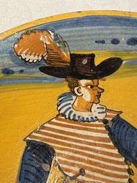 An Italian maiolica dish with a swordsman, Montelupo, early 17th C.