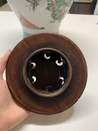 A Chinese famille rose coral-red-ground vase and a famille verte vase, 19th C.