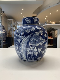 Two Chinese blue and white 'peonies' and 'peonies and antiquities' jars and covers, 19th C.