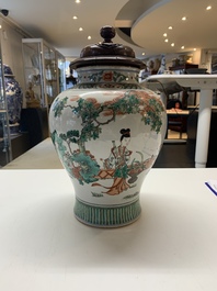 A Chinese famille rose coral-red-ground vase and a famille verte vase, 19th C.