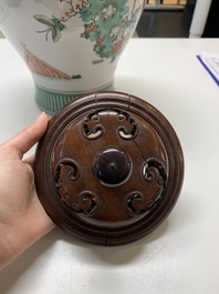 A Chinese famille rose coral-red-ground vase and a famille verte vase, 19th C.