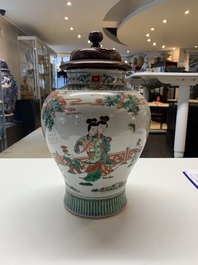 A Chinese famille rose coral-red-ground vase and a famille verte vase, 19th C.