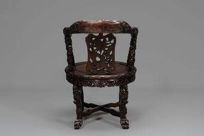 A pair of Chinese finely carved hongmu swivel chairs, Canton, 19th C.