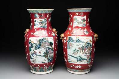 A pair of Chinese famille rose ruby-ground 'landscape' vases, 19th C.