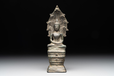 A Khmer bronze figure of Buddha Mucilinda, Angkor period, 12/13th C.
