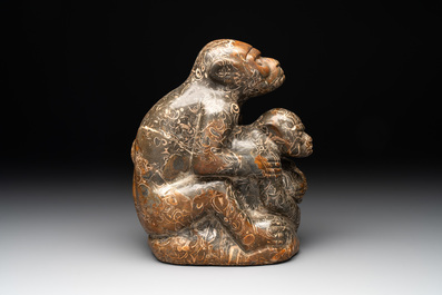 A Chinese stone group of a two monkeys, 20th C.