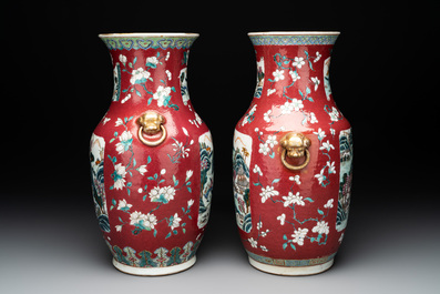 A pair of Chinese famille rose ruby-ground 'landscape' vases, 19th C.