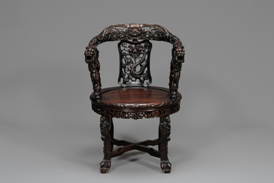 A pair of Chinese finely carved hongmu swivel chairs, Canton, 19th C.