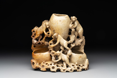 A Chinese soapstone water container with four monkeys, 20th C.
