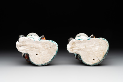 A pair of Japanese polychrome boy-shaped vases, 19th C.