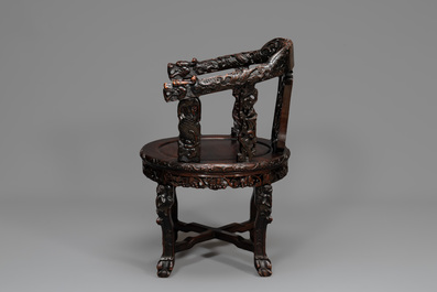 A pair of Chinese finely carved hongmu swivel chairs, Canton, 19th C.