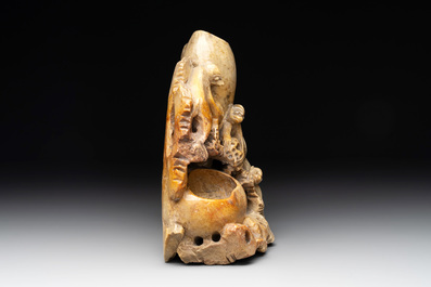 A Chinese soapstone water container with four monkeys, 20th C.