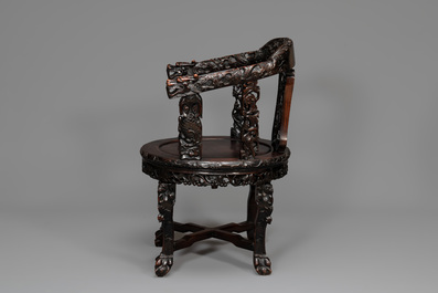 A pair of Chinese finely carved hongmu swivel chairs, Canton, 19th C.