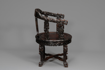 A pair of Chinese finely carved hongmu swivel chairs, Canton, 19th C.