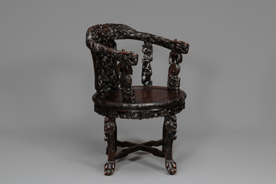 A pair of Chinese finely carved hongmu swivel chairs, Canton, 19th C.