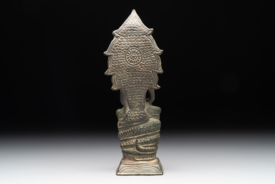 A Khmer bronze figure of Buddha Mucilinda, Angkor period, 12/13th C.