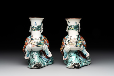 A pair of Japanese polychrome boy-shaped vases, 19th C.