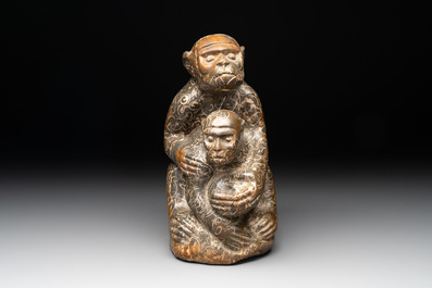 A Chinese stone group of a two monkeys, 20th C.